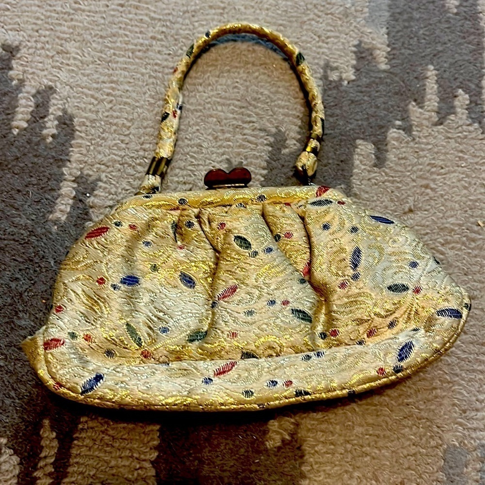 Vintage, small purse with gold, multi design, pattern, and silk inside